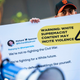 An activist holds a sign with an enlarged tweet while protesting with the activist group, Change the Terms Reducing Hate Online, outside Twitter Headquarters in San Francisco, California on November 19, 2019.